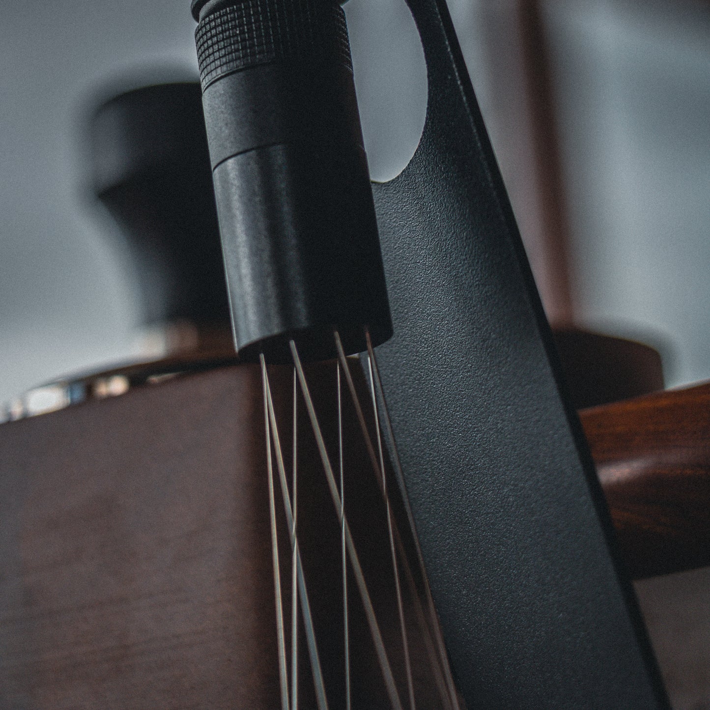 Black magnetic wdt espresso tool on its stand