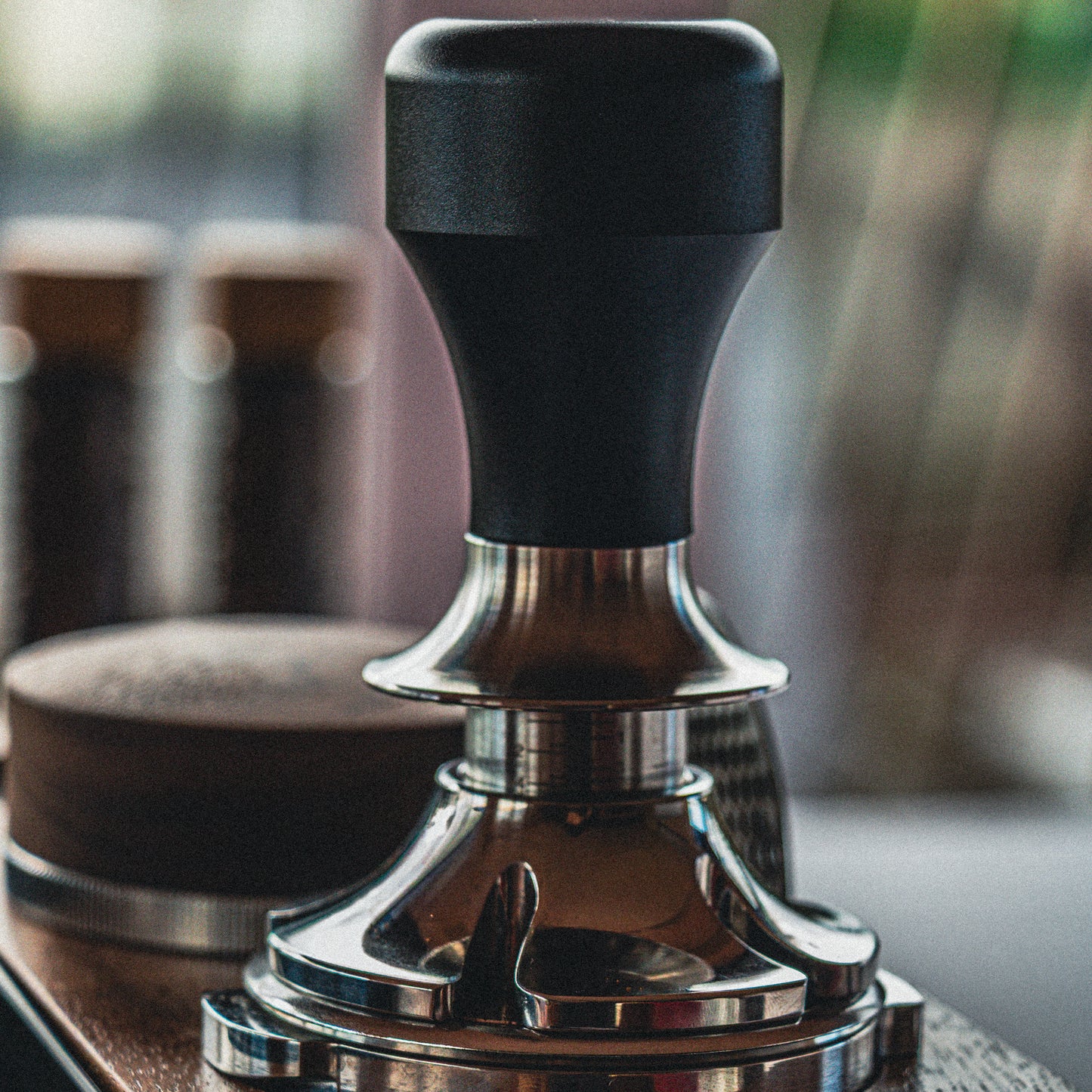Coffee tamp with a blurred background