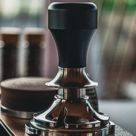 Coffee tamp with a blurred background