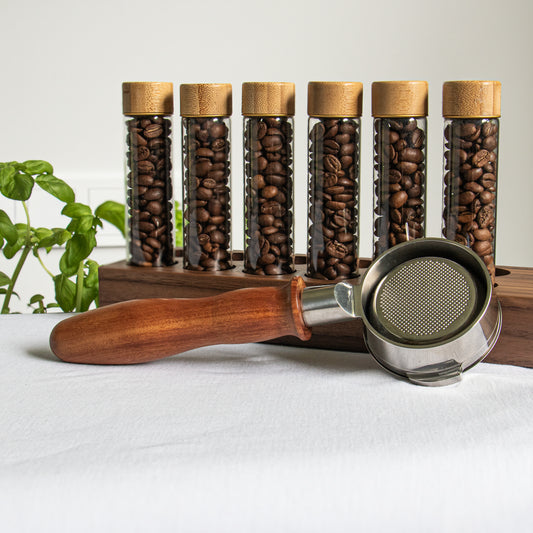 Bottomless wooden portafilter near coffee beans cellars