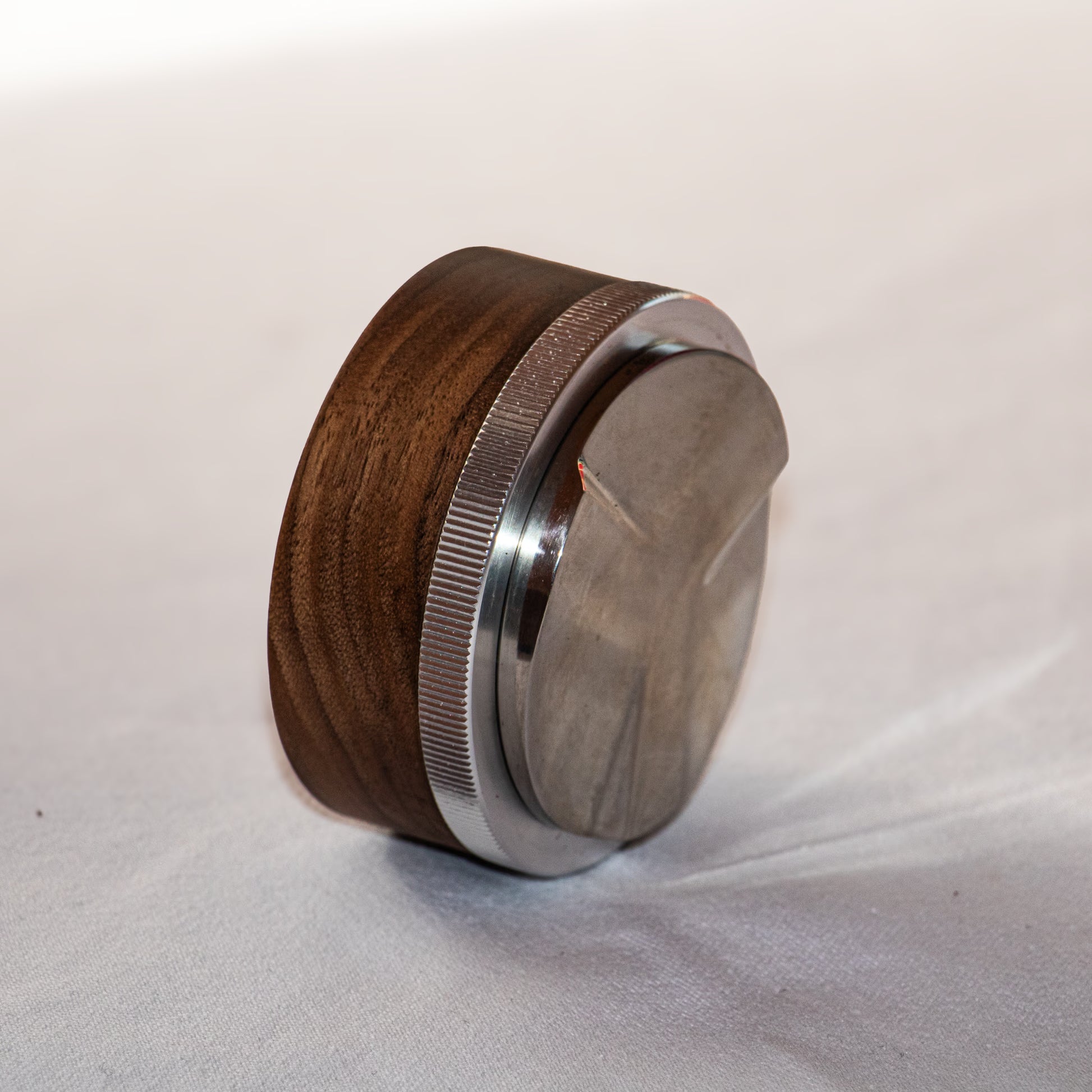 Espresso distribution tool in white backgound