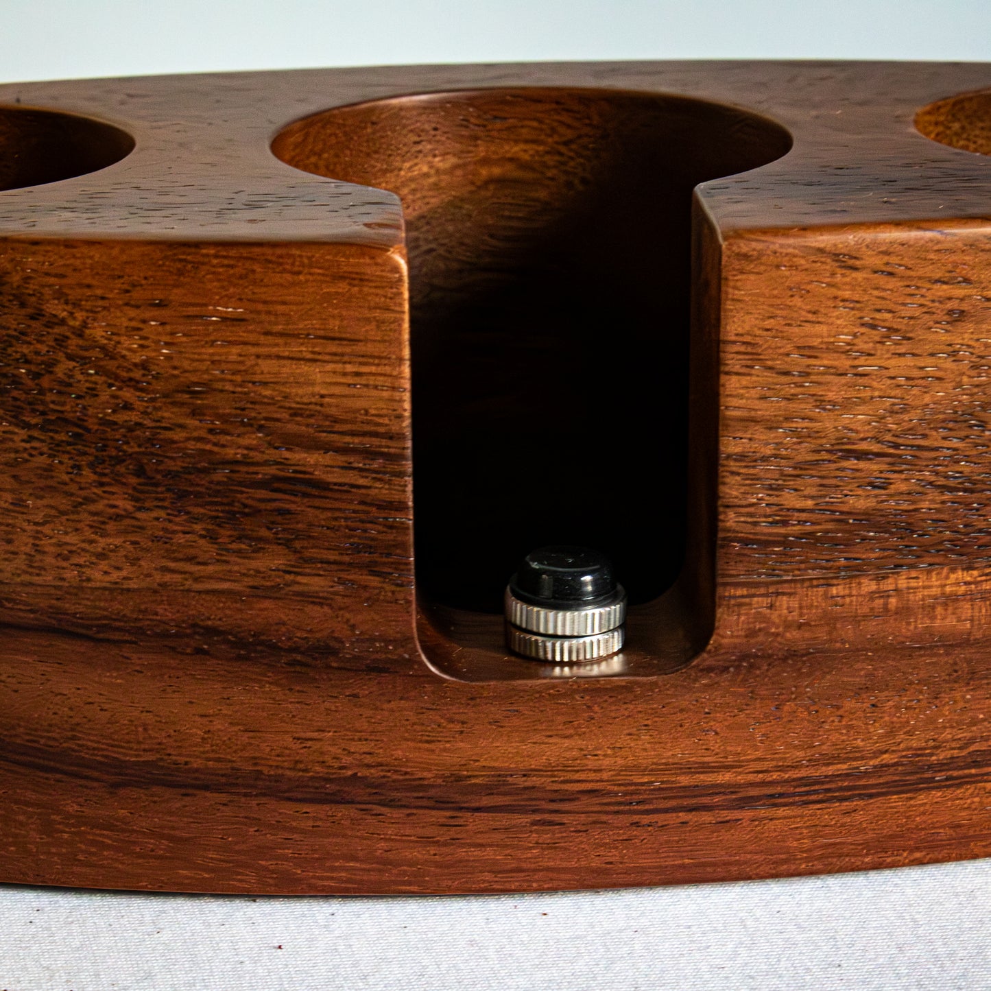 Wooden espresso tamping station zoomed in