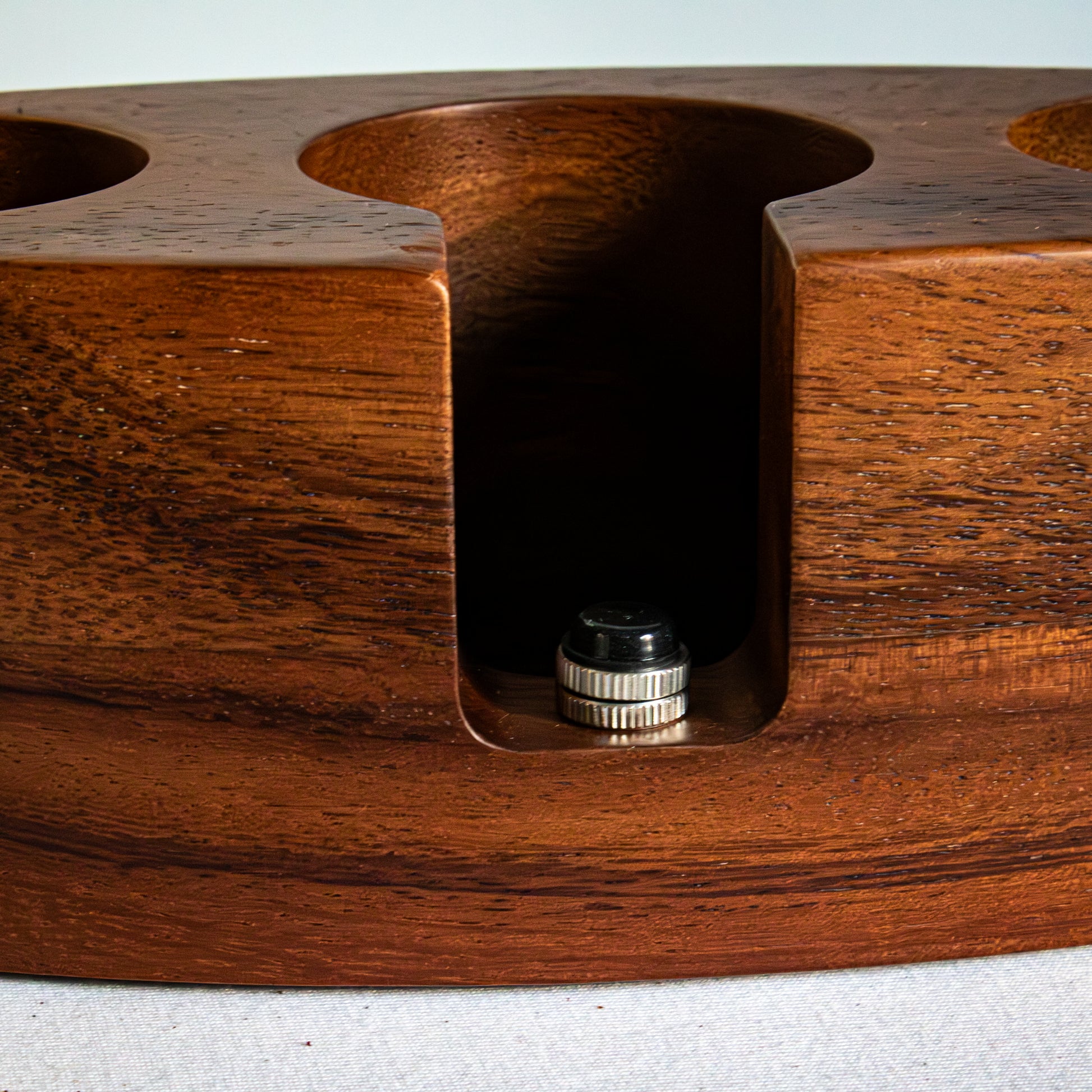 Wooden espresso tamping station zoomed in