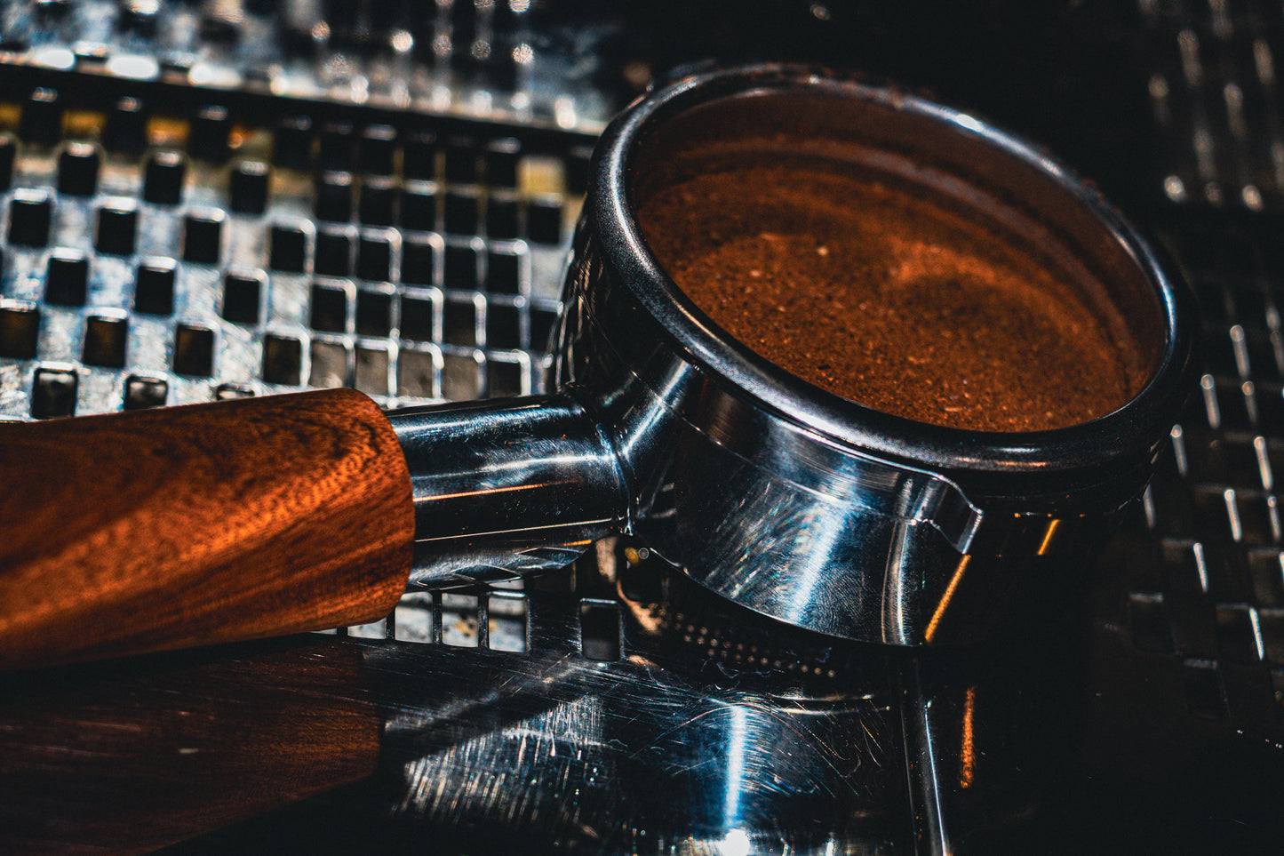Espresso shot in a portafilter on a metallic surface