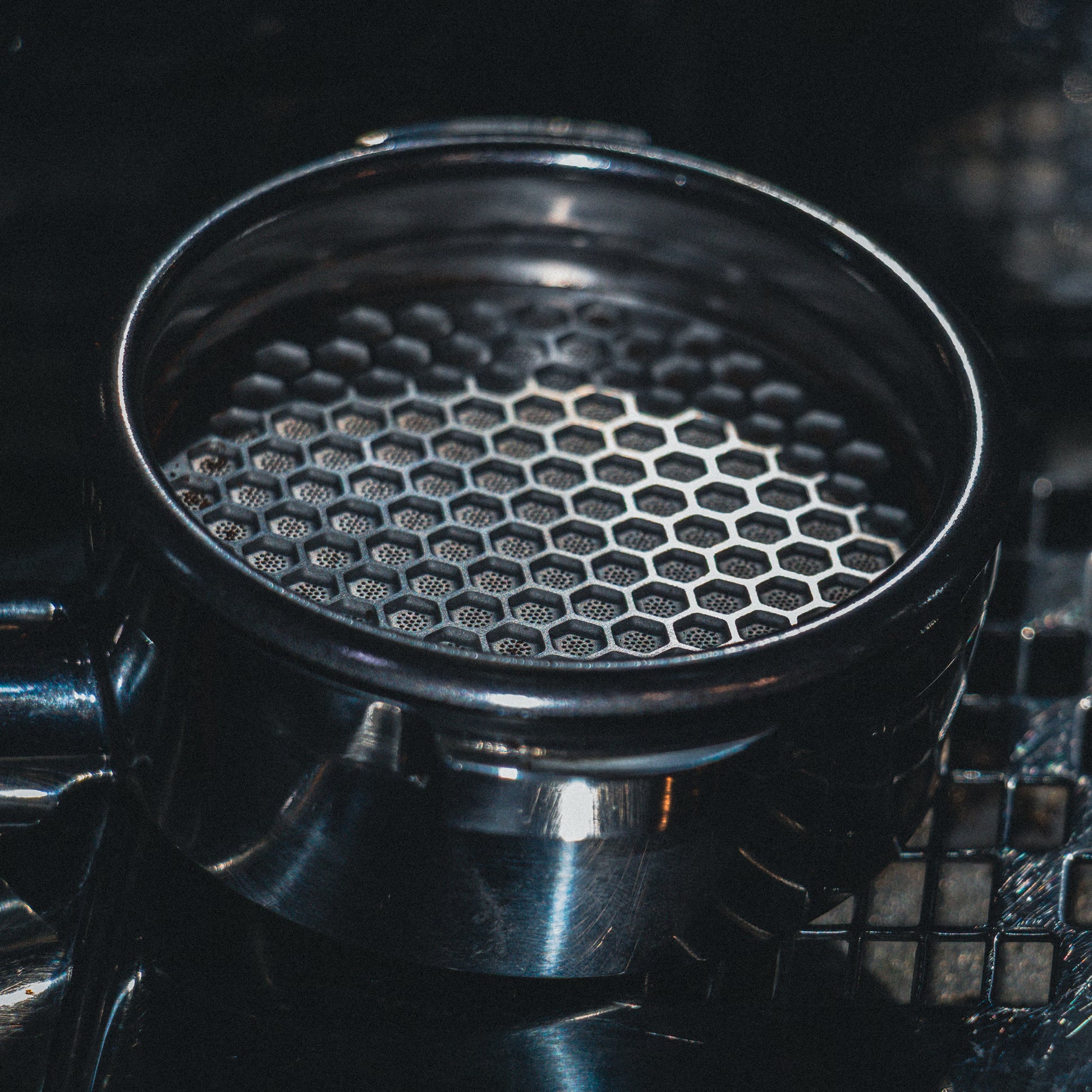 Metallic honeycomb puck screen close up photo