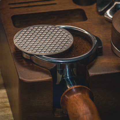 Puck screen on a wooden tamping station