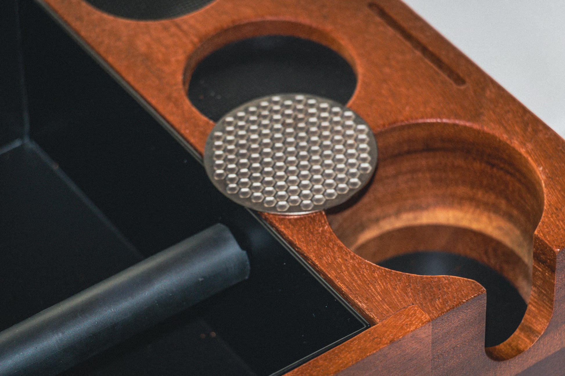 Puck screen on wooden tamping station