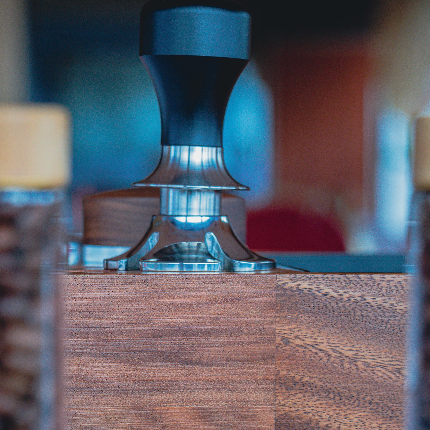 Tamper on tamp station in bluish light