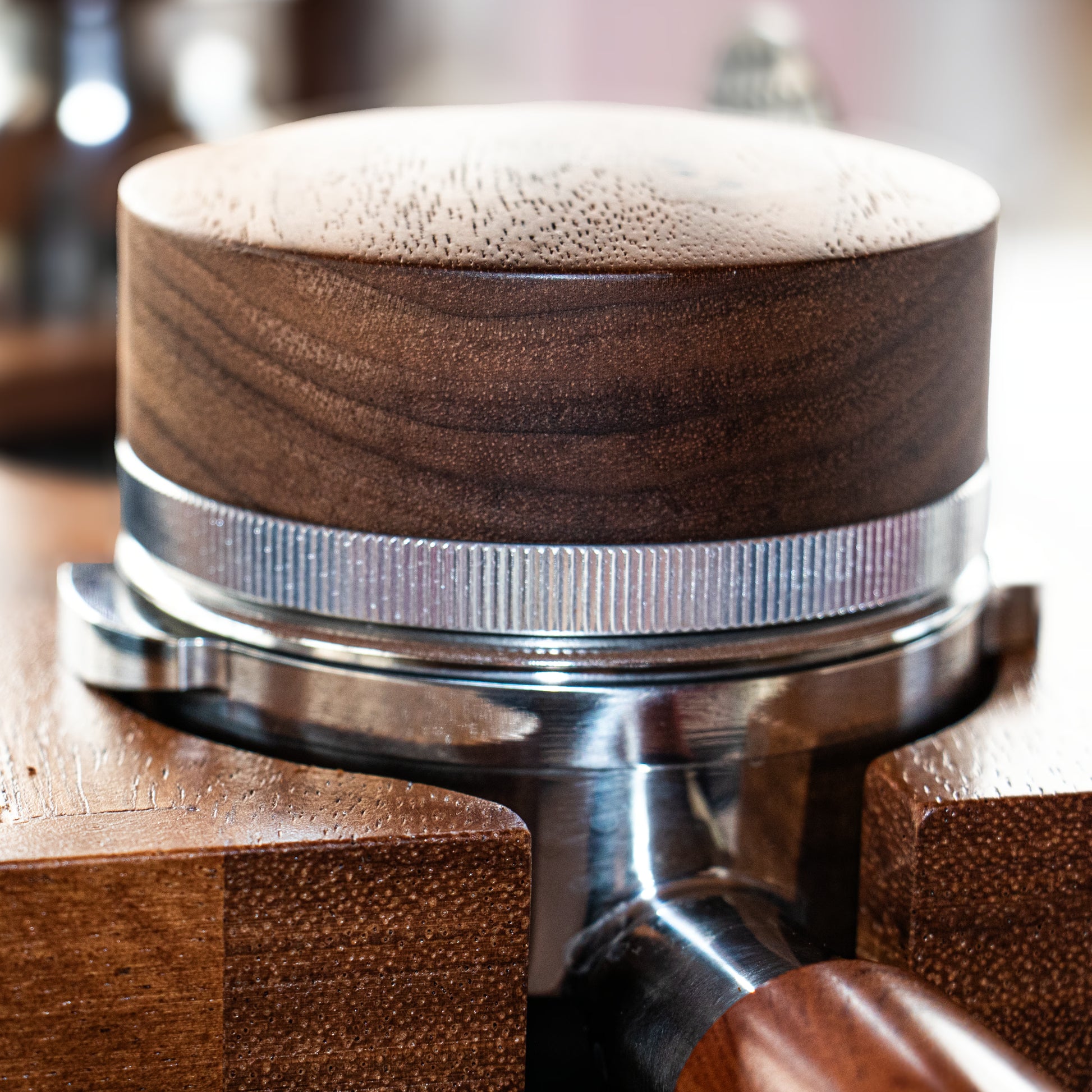 Wooden espresso distributor tool on a portafilter