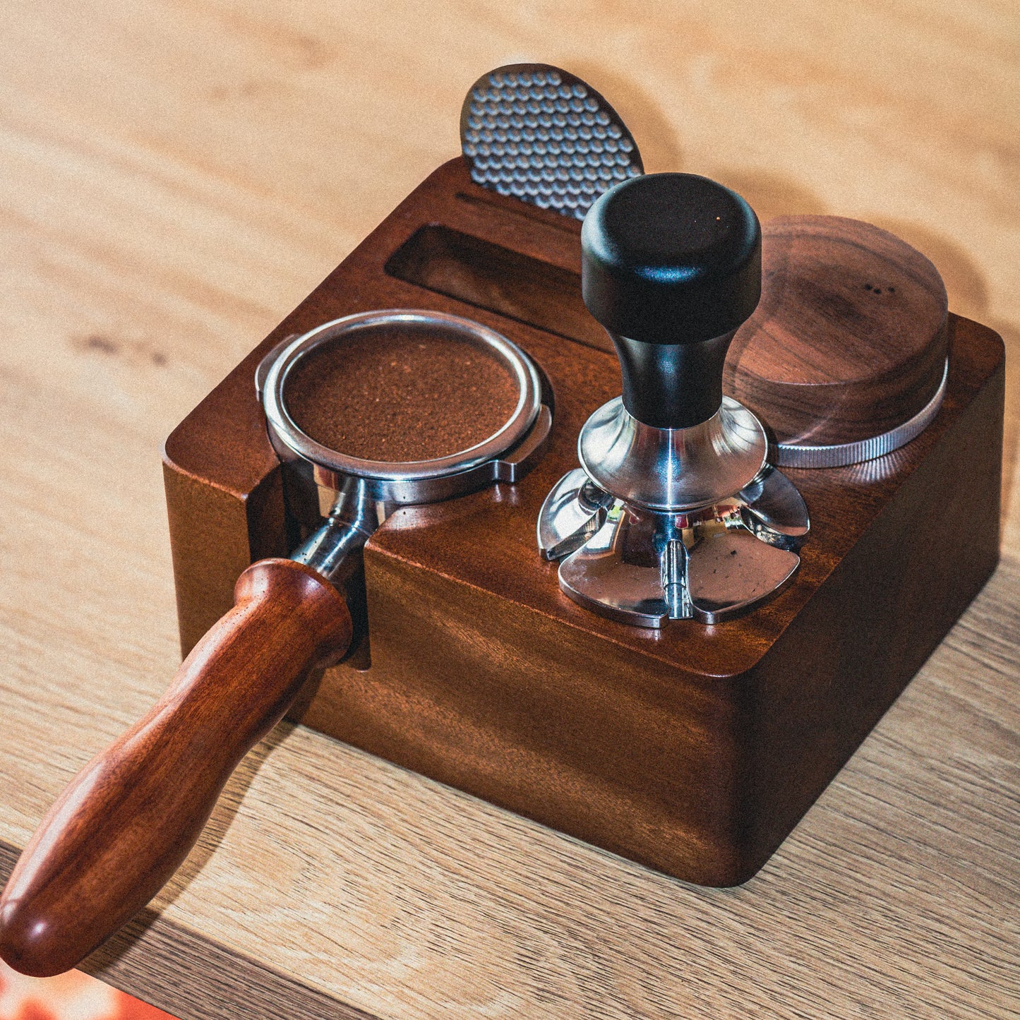 Espresso tamping on a wooden countertop